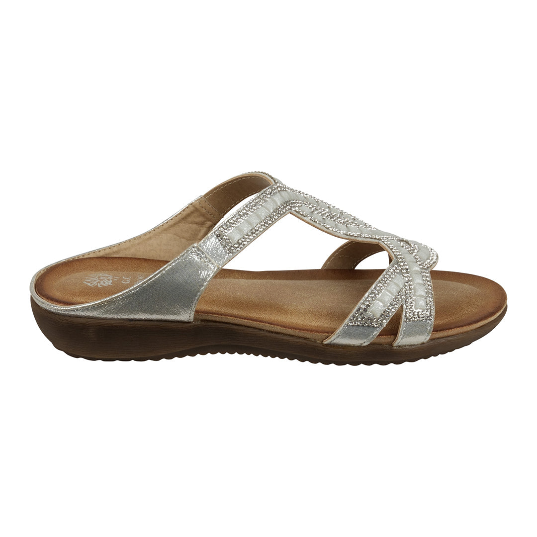 Brown sandal with silver straps on a white background