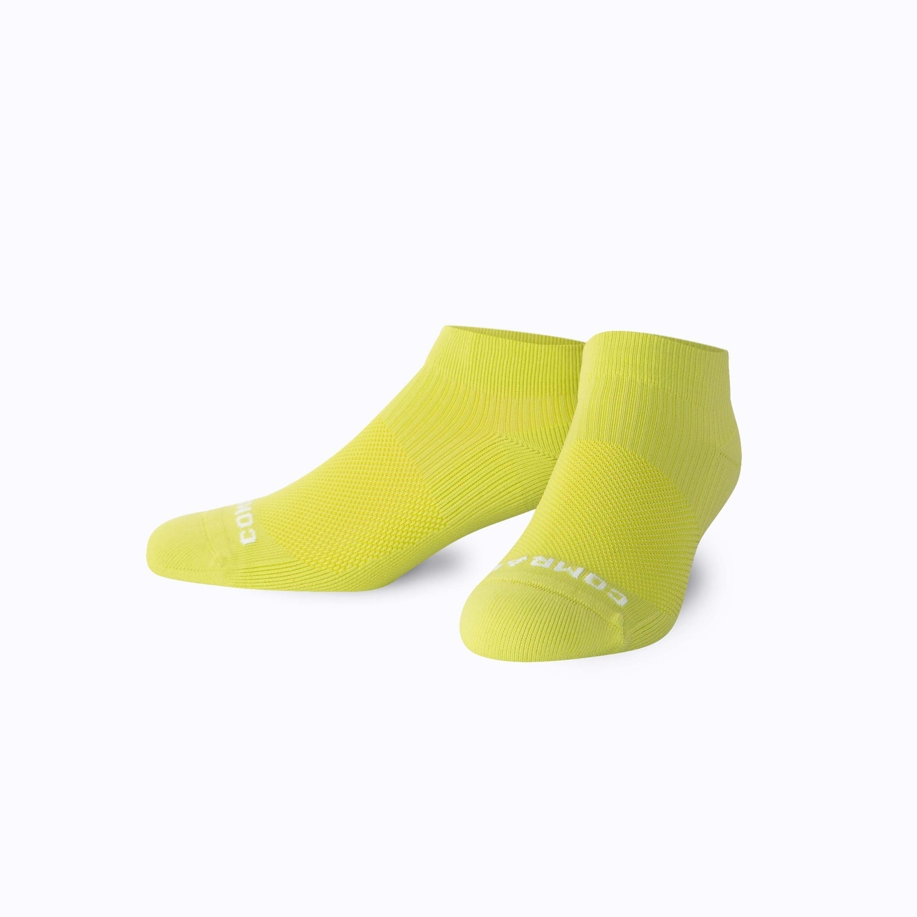 Pair of yellow socks on a white background