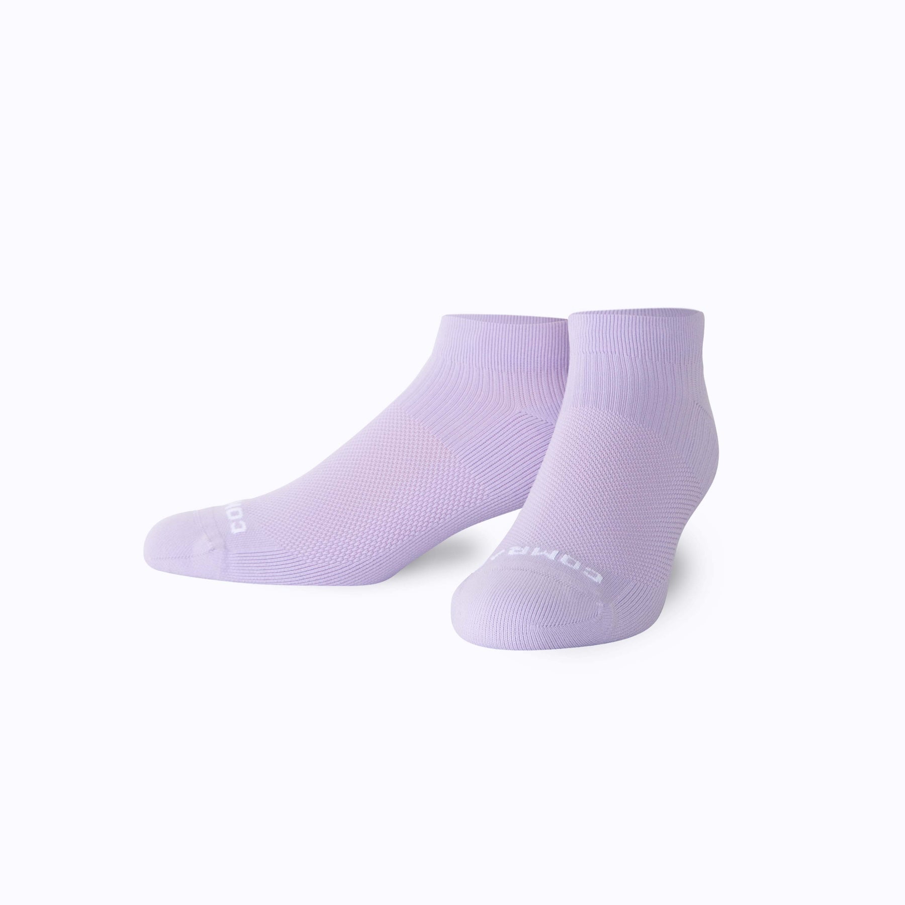Pair of light purple socks on a white background