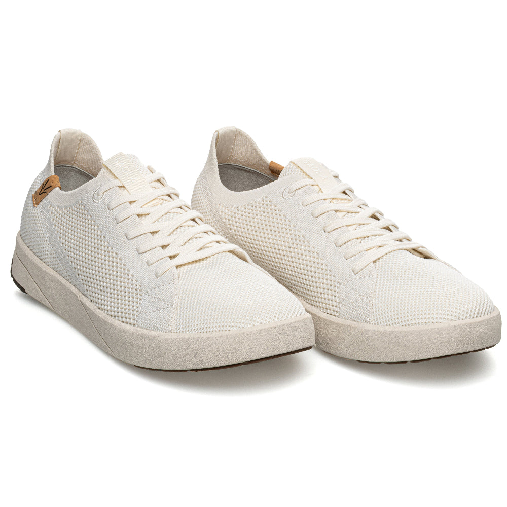 Pair of white sneakers on a white background