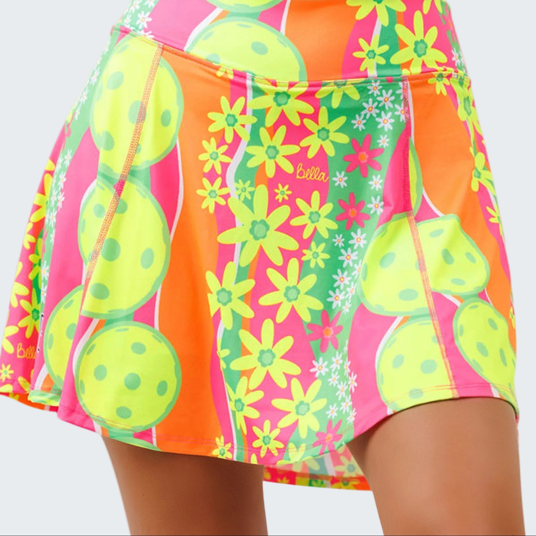Colorful skirt with floral and fruit patterns on a white background