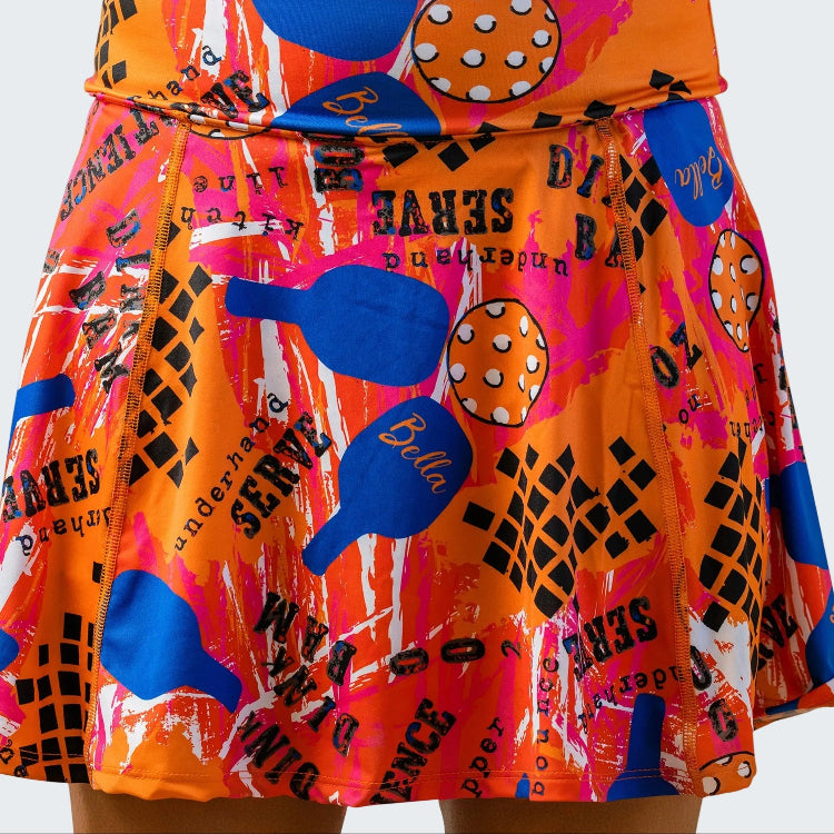 Colorful skirt with tennis-themed design on a white background