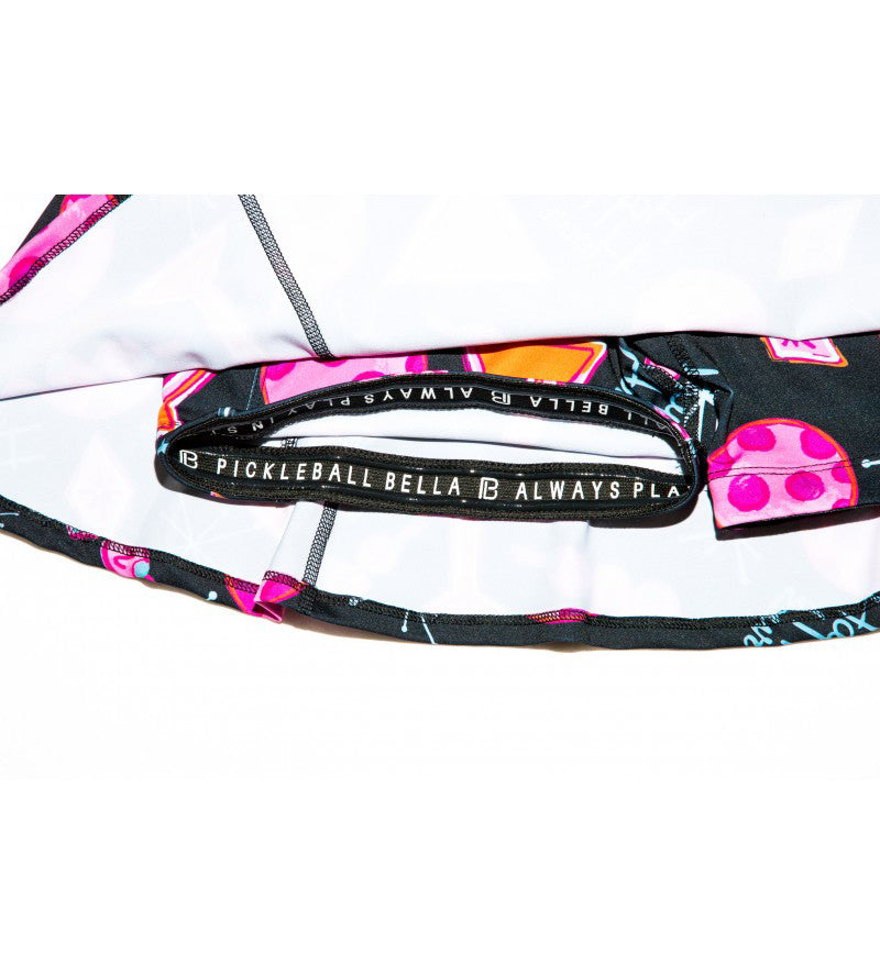 Pickleball paddle with colorful design and text on a white background