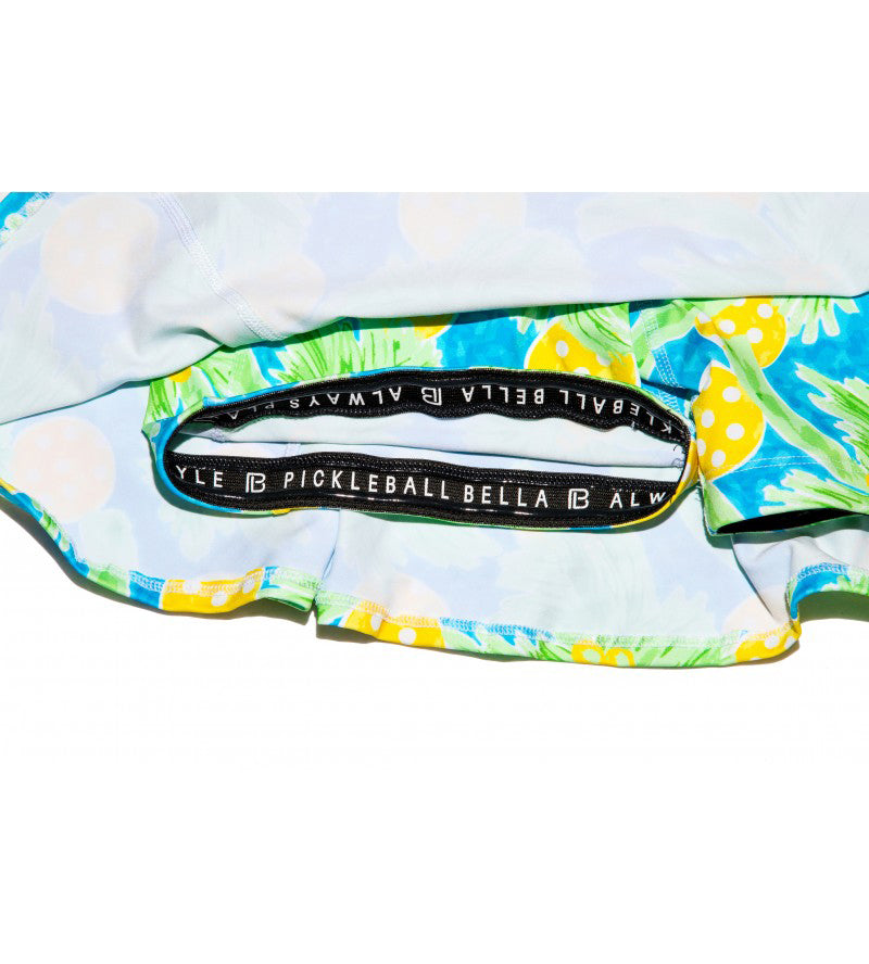 Pickleball racket cover with floral design and Bella B logo on a white background