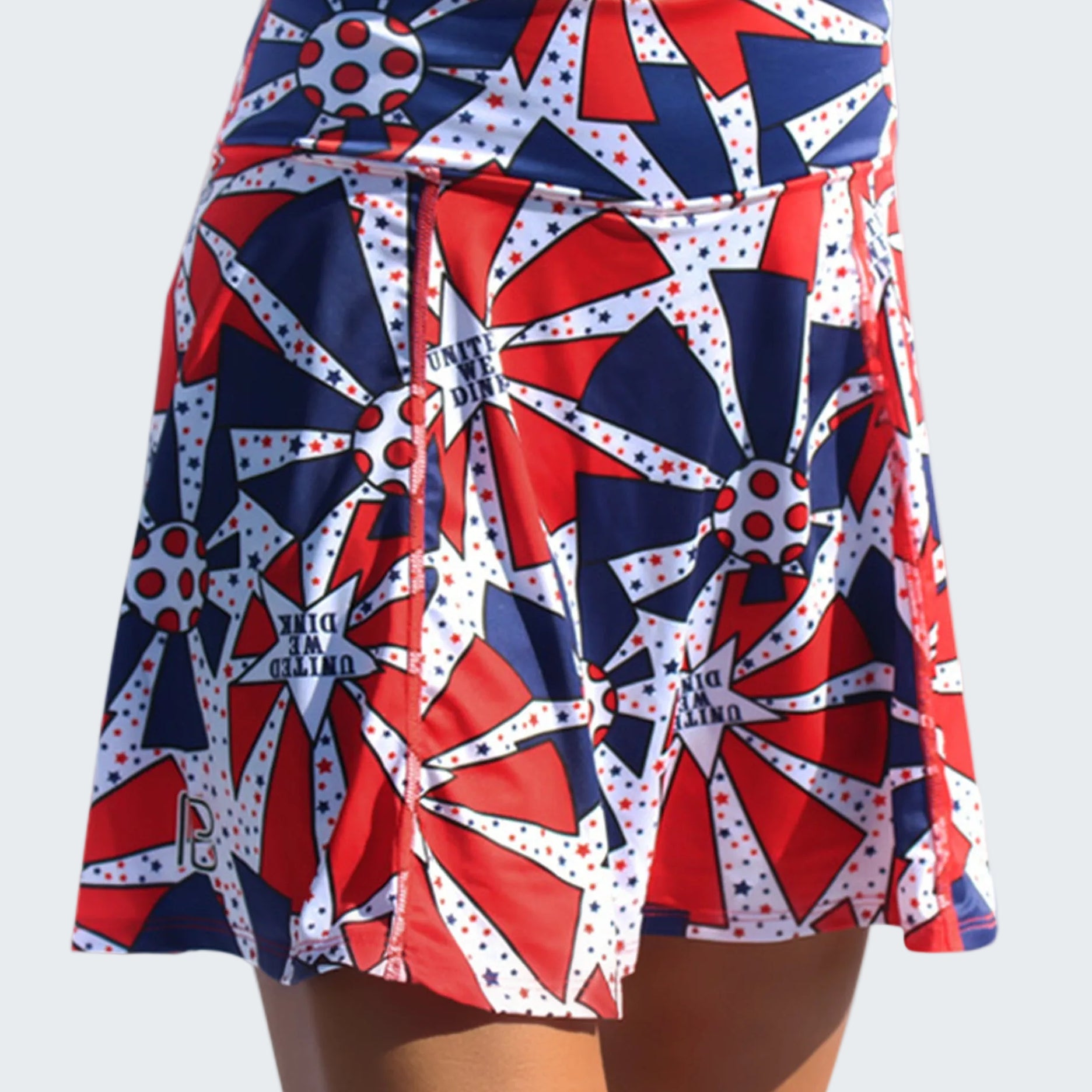Skirt with red, white, and blue geometric pattern on a white background