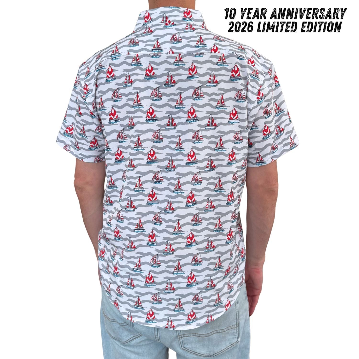 Short-sleeve shirt with boat pattern and '10 Year Anniversary 2026 Limited Edition' text on a white background