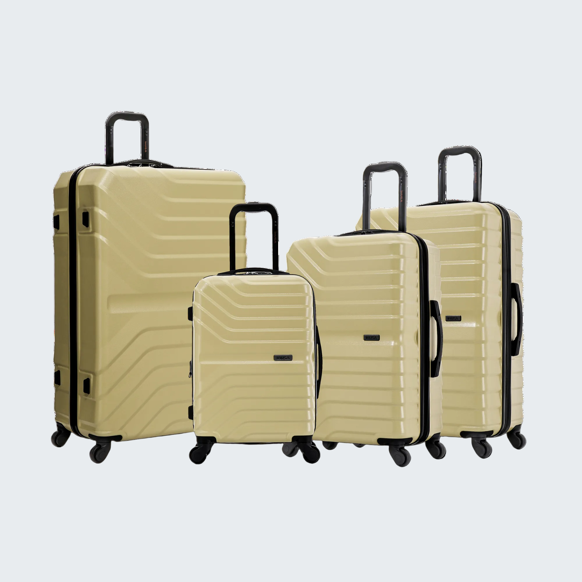 Set of beige suitcases with black handles and wheels on a white background