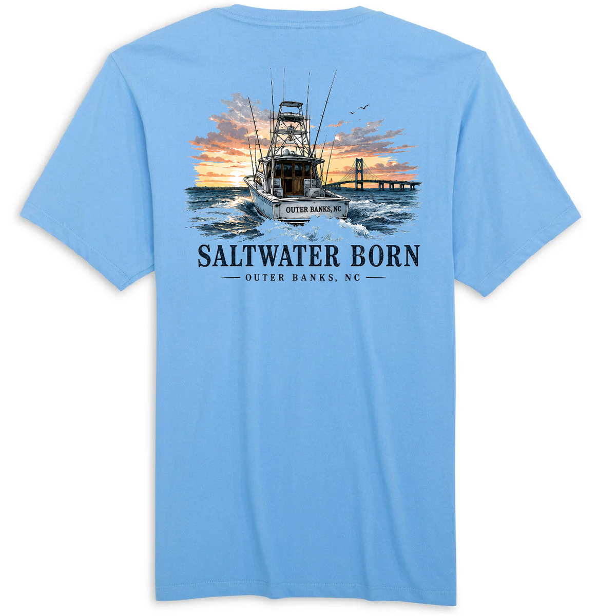 A light blue short-sleeve t-shirt shown from the back, featuring a large graphic print of a fishing boat on the water at sunset with the text 'SALTWATER BORN' and 'OUTER BANKS, NC'.