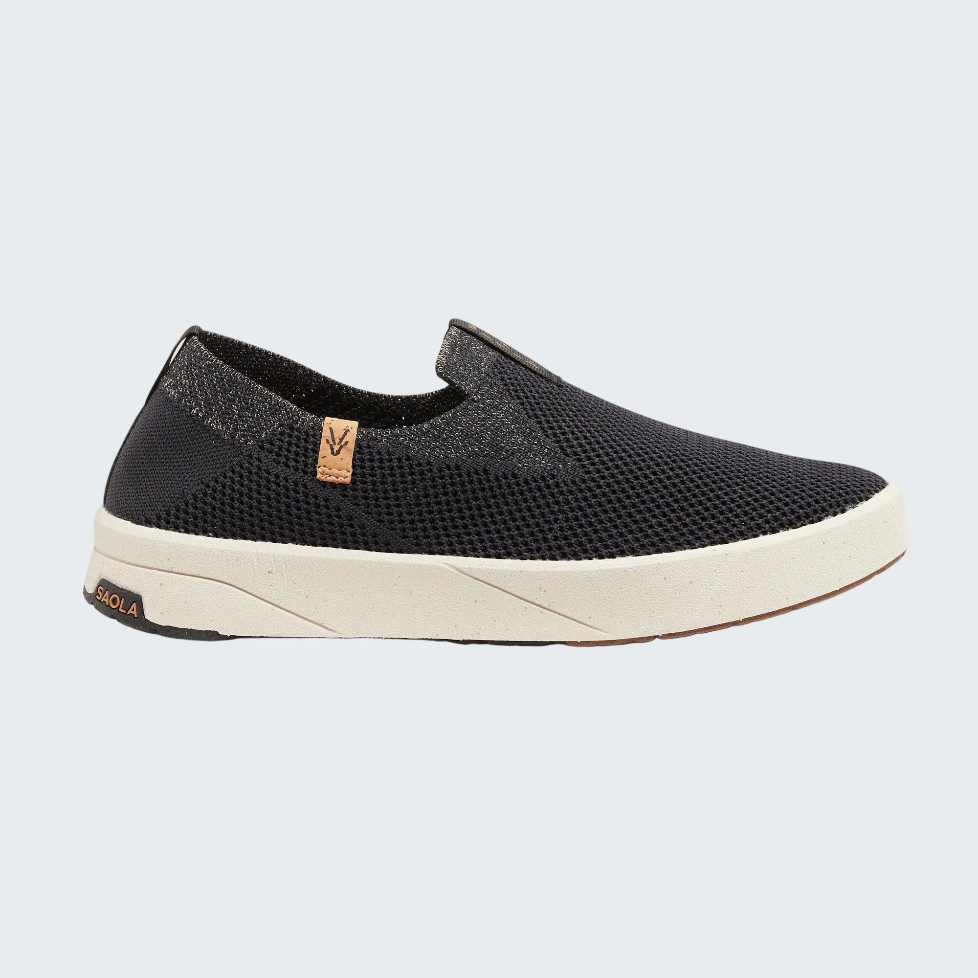 Black sneakers with white soles on a white background