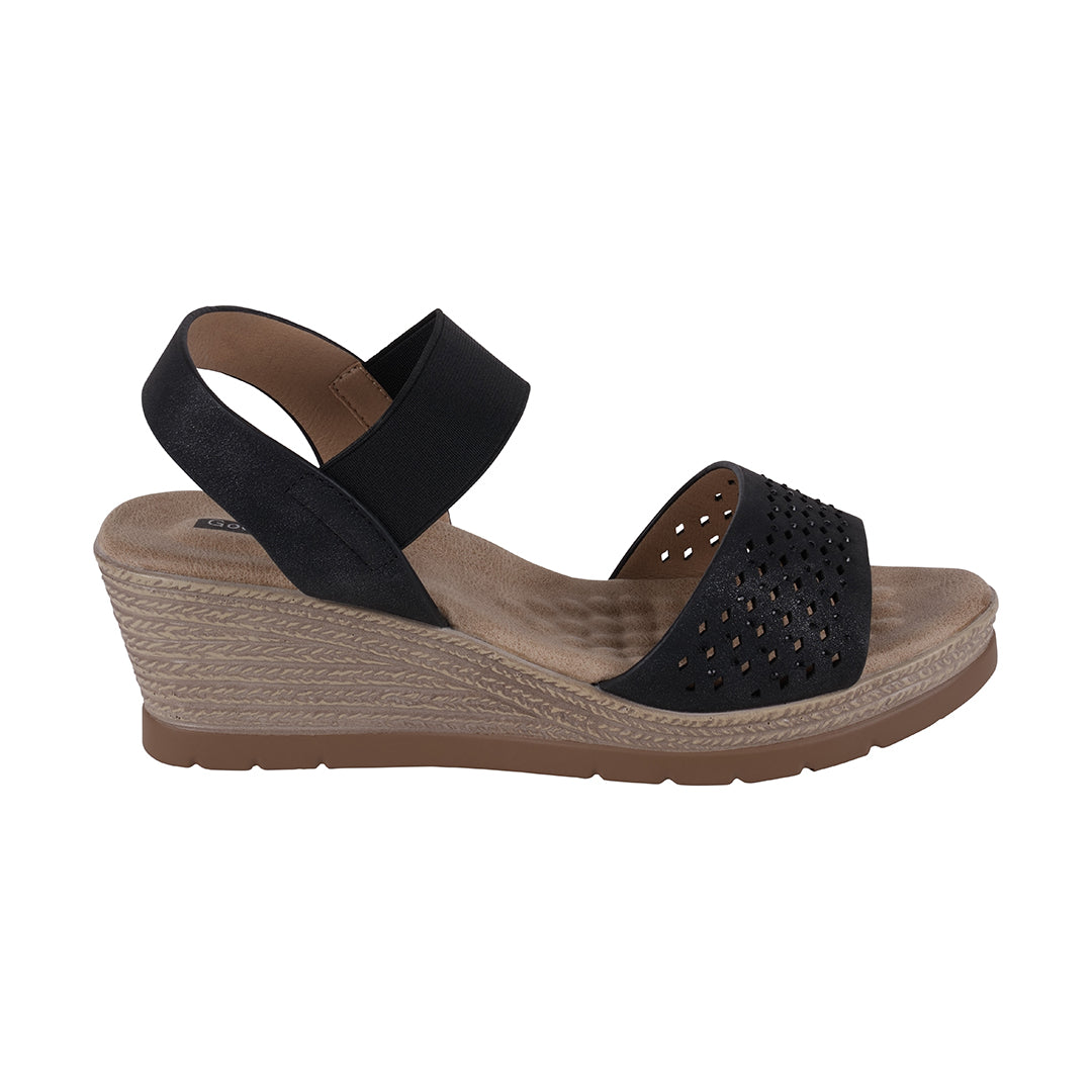 Black wedge sandal with a textured sole on a white background
