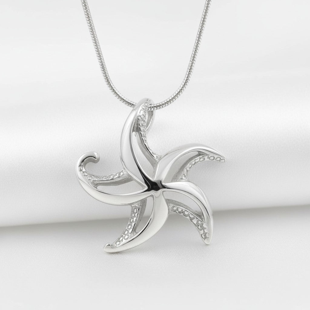 Silver starfish pendant on a white background