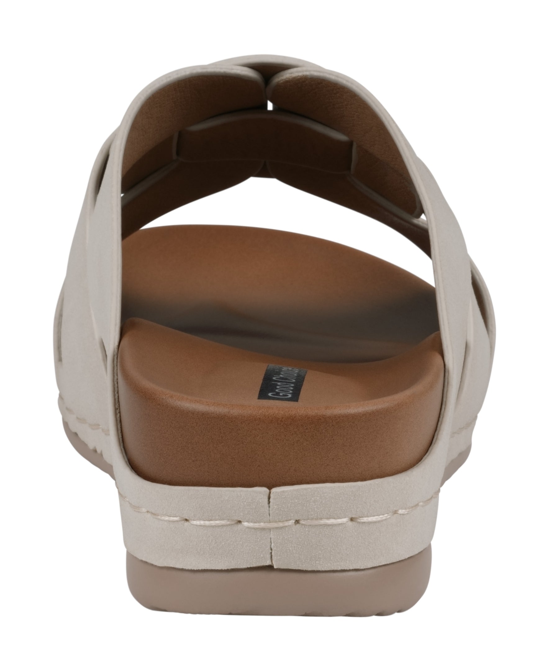 Beige sandal with a brown sole on a white background