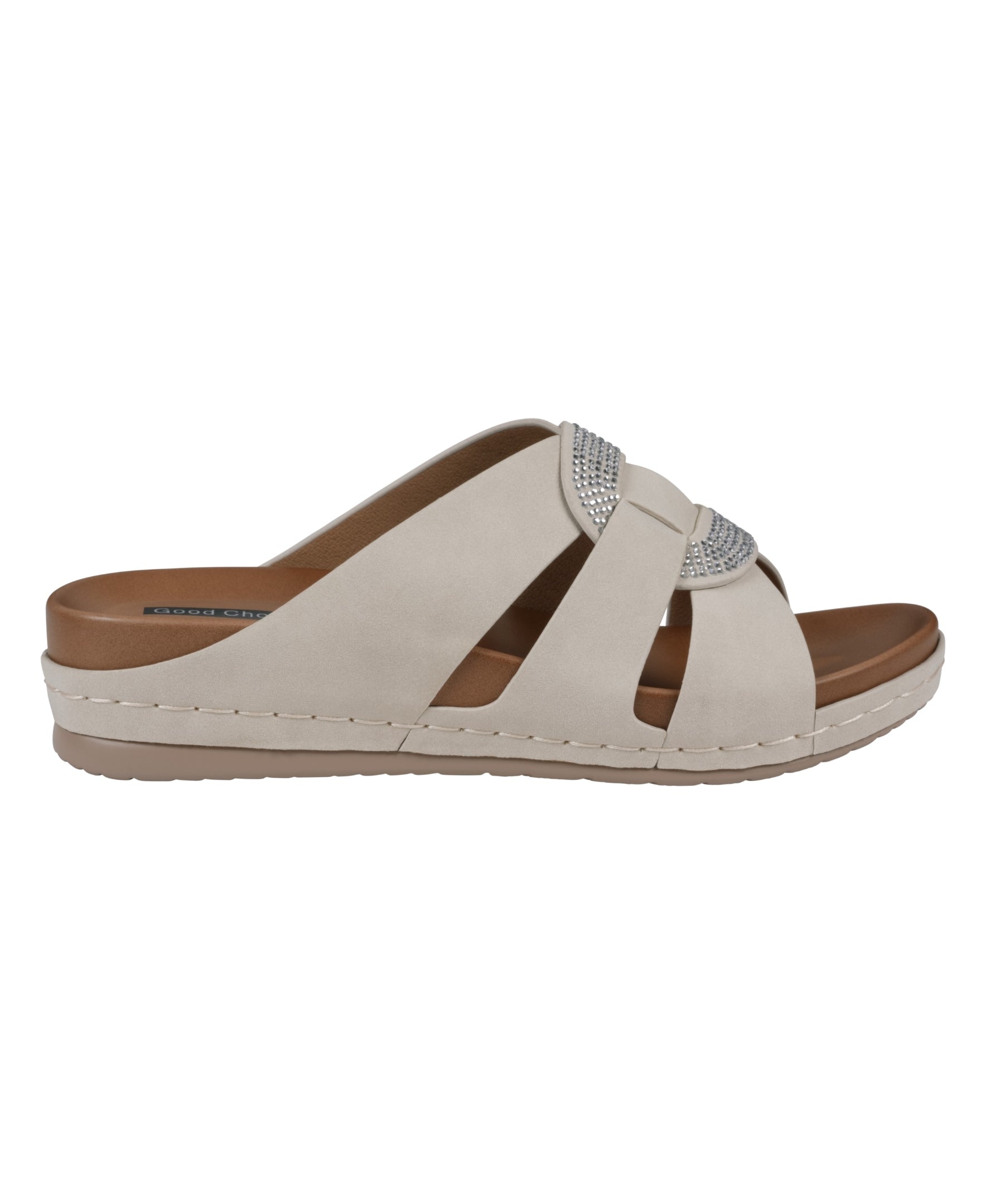 Beige sandal with a brown sole on a white background