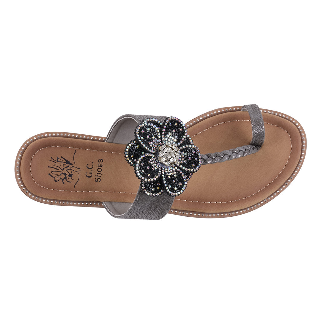 Flip-flop sandal with a decorative flower on a white background