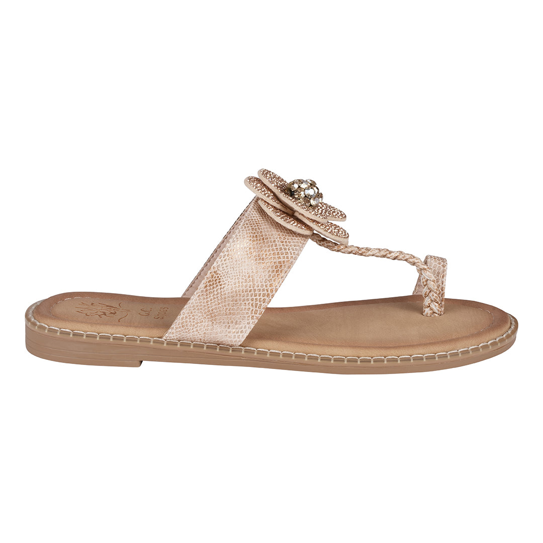 Beige sandal with decorative strap on a white background