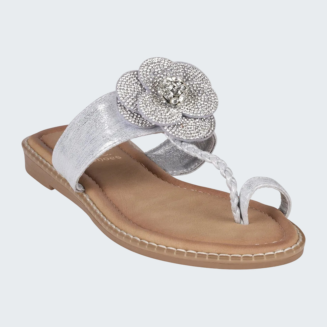 Silver sandal with a decorative flower on a white background