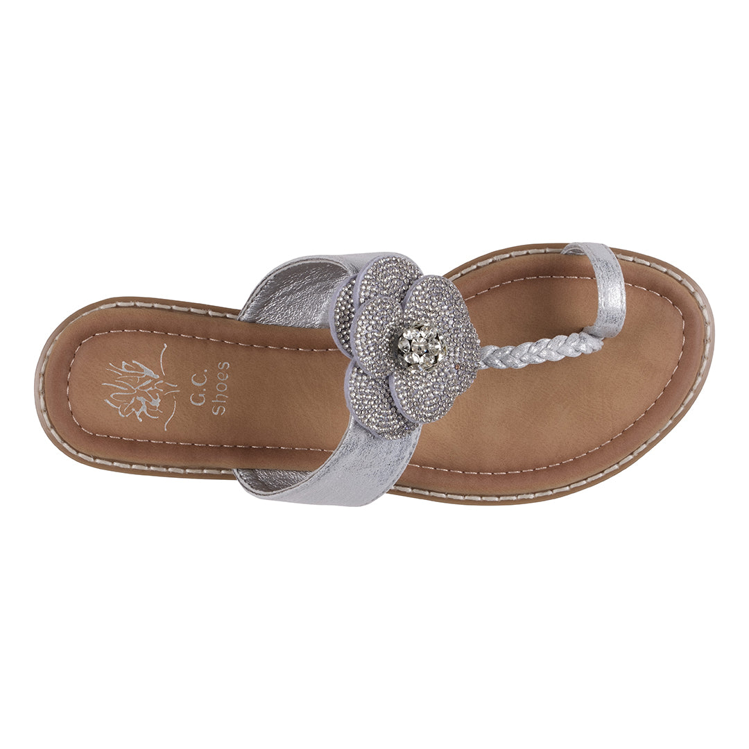 Silver sandal with a decorative flower on a white background