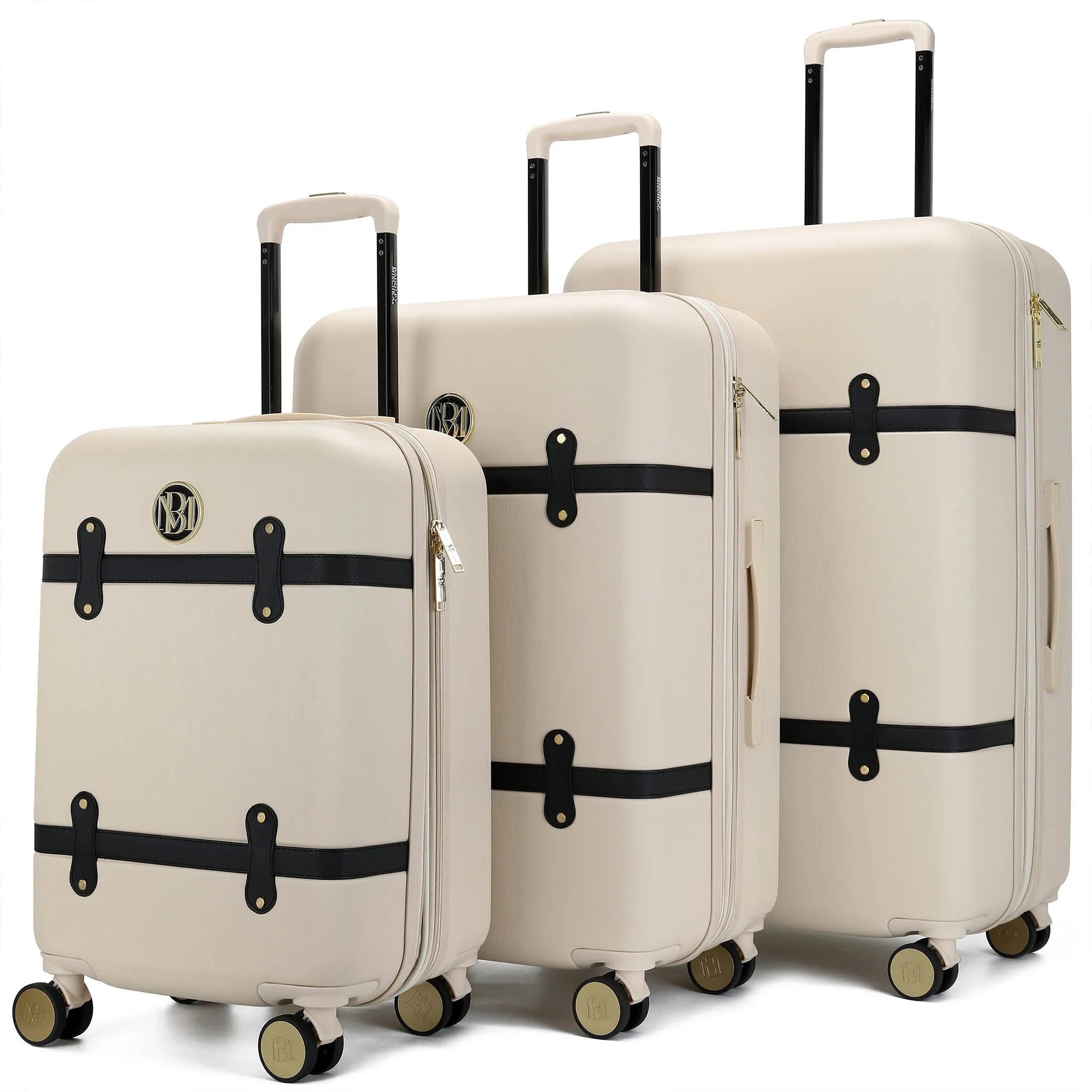 Set of three beige suitcases with black straps on a white background