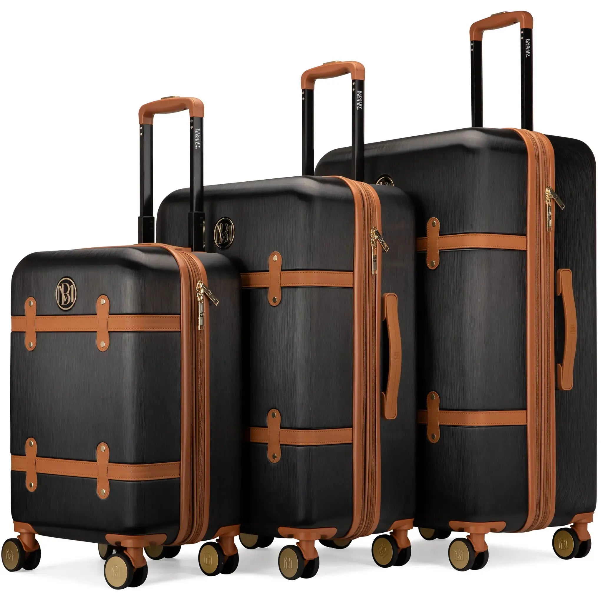 Set of black suitcases with brown accents on a white background