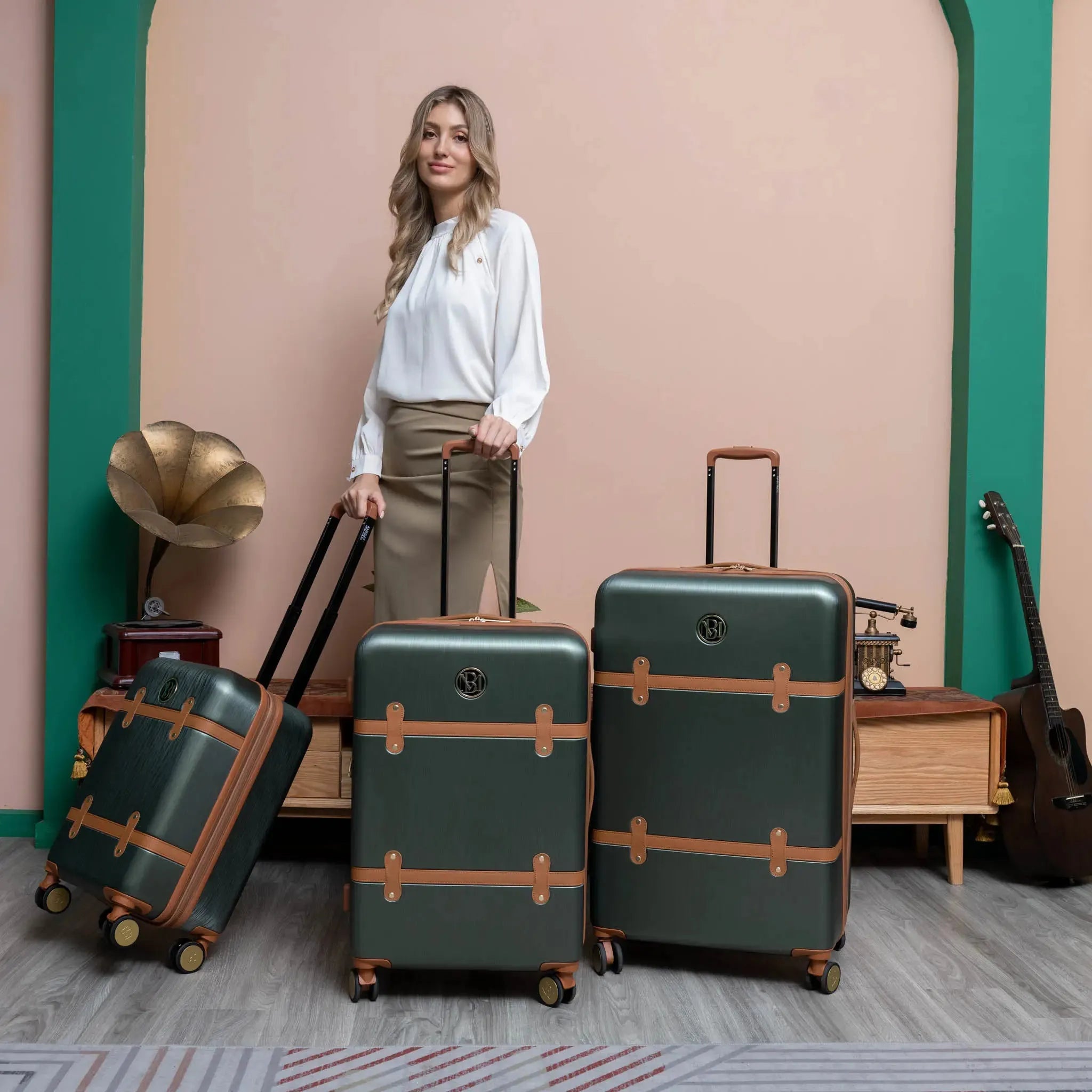 Woman standing with green suitcases in a room with a vintage-style decor.
