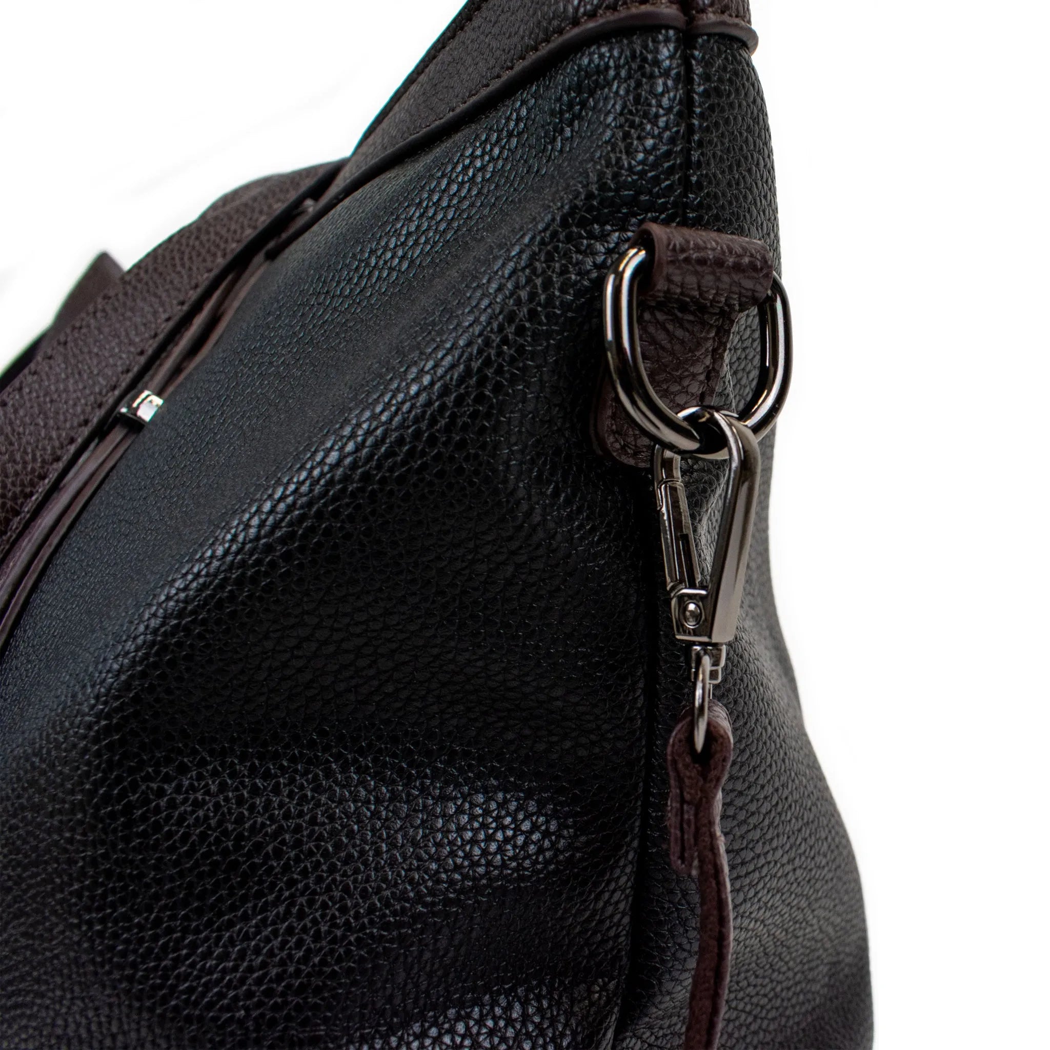 Close-up of a black leather bag with a zipper on a white background