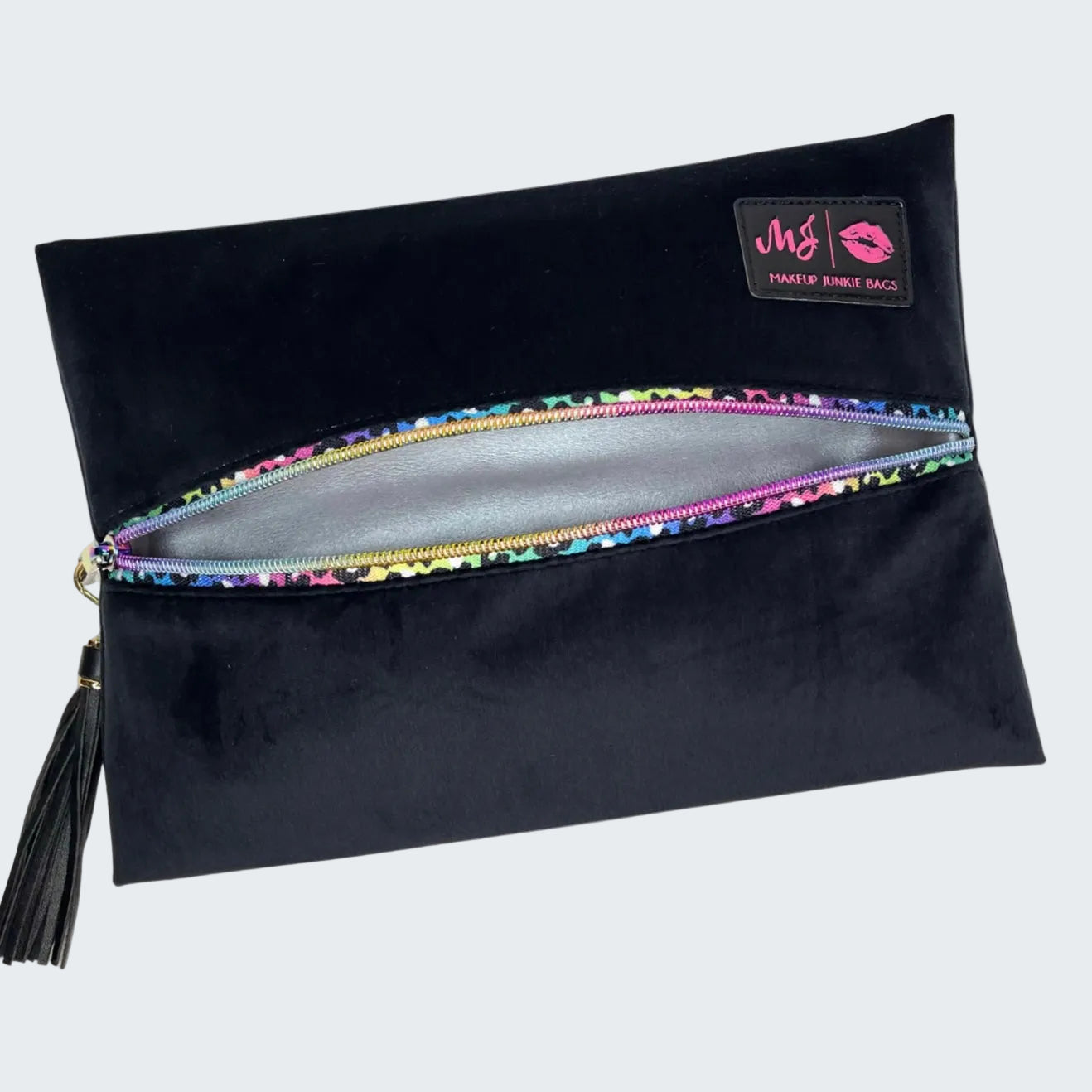 Black makeup bag with colorful zipper and visible brand logo on a white background