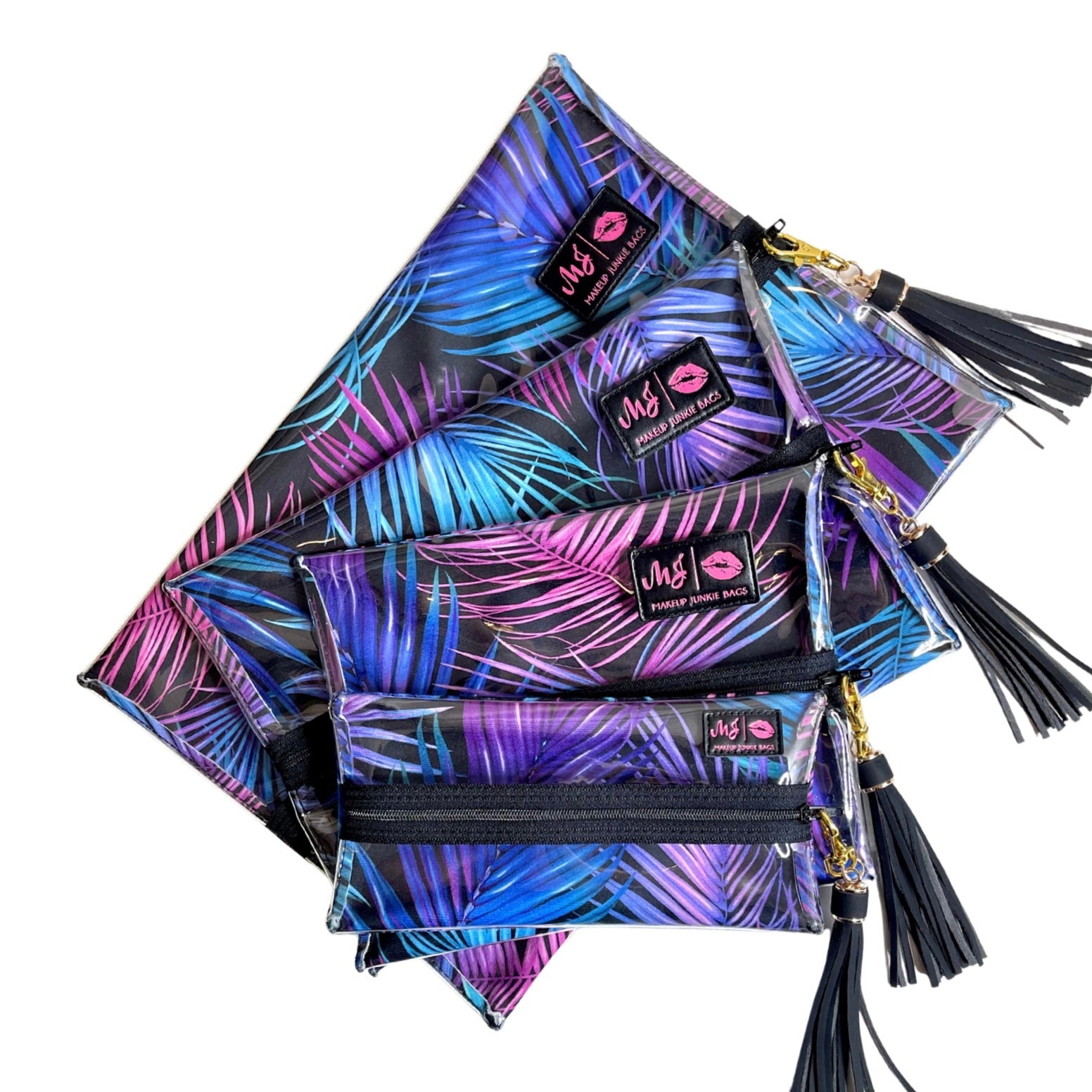 Set of colorful palm leaf patterned pouches with tassels on a white background