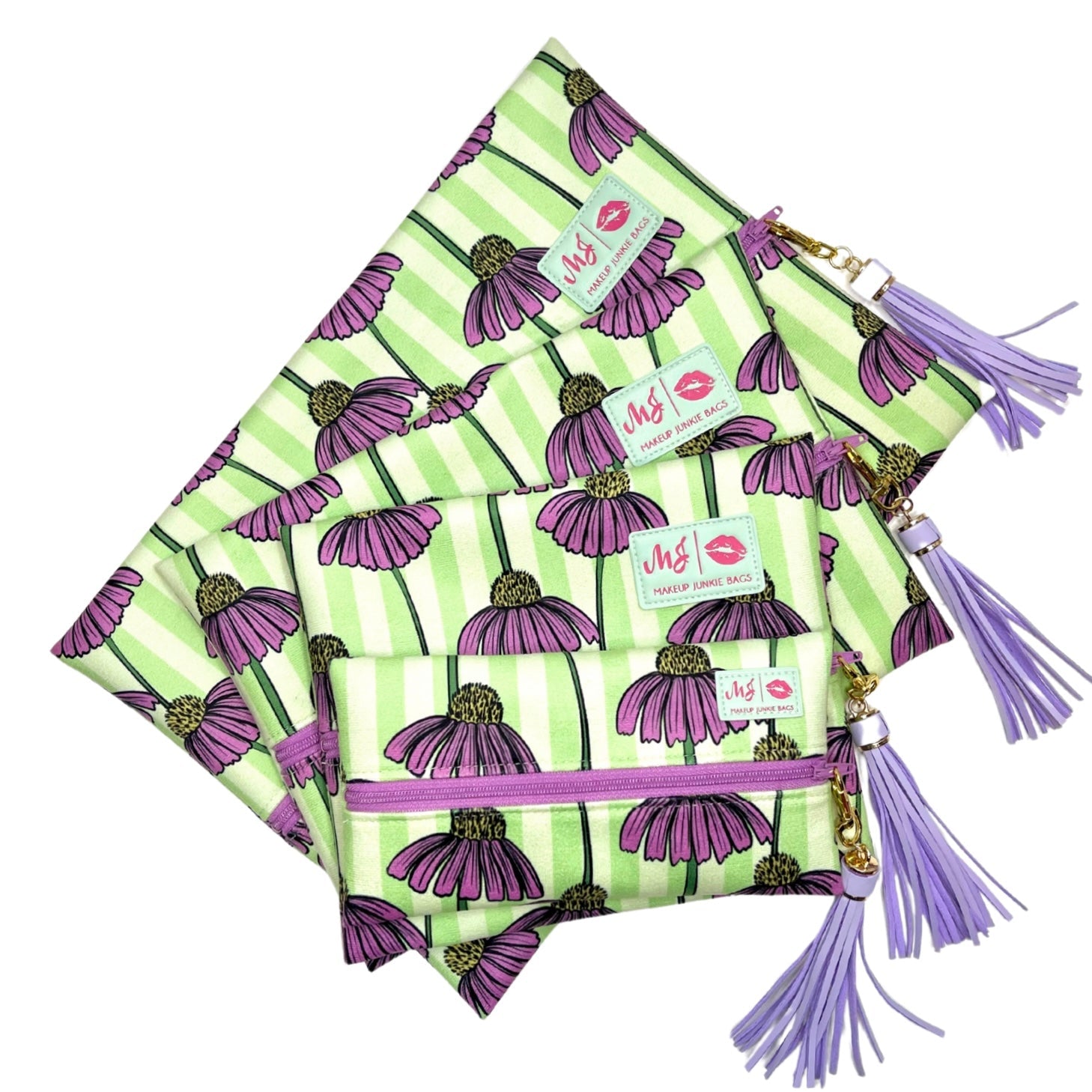 Set of green and purple patterned bags with tassels on a white background