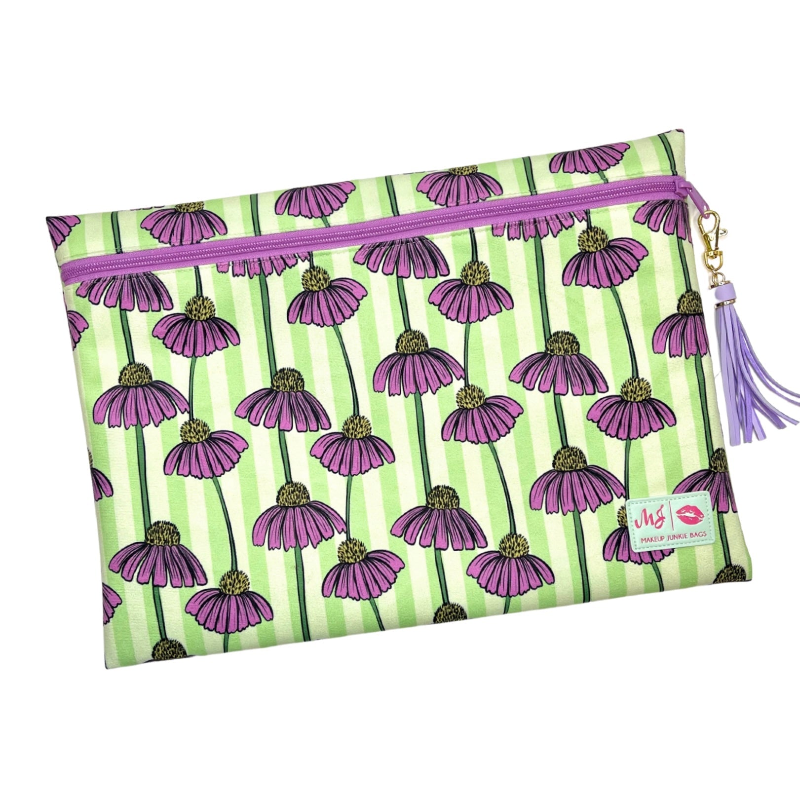 Pouch with purple flower pattern on green stripes with a tassel on a white background