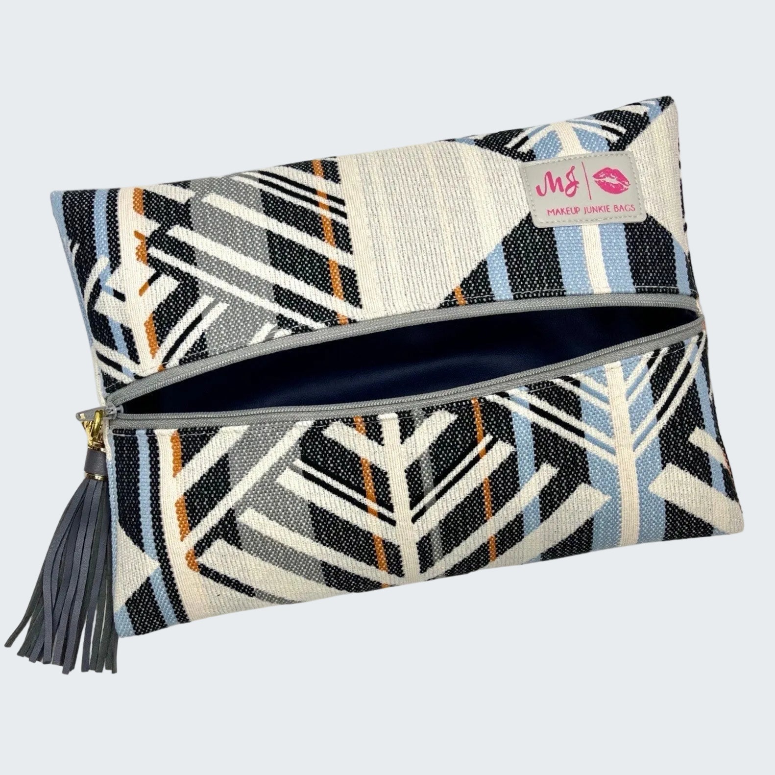 Patterned clutch bag with a visible brand label on a white background