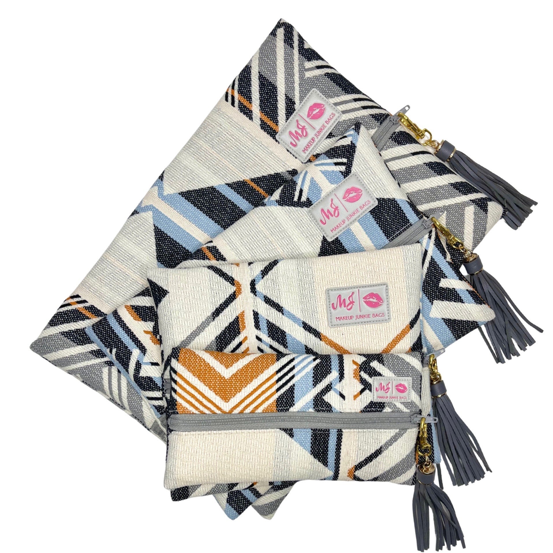 Set of patterned bags with visible brand tags on a white background
