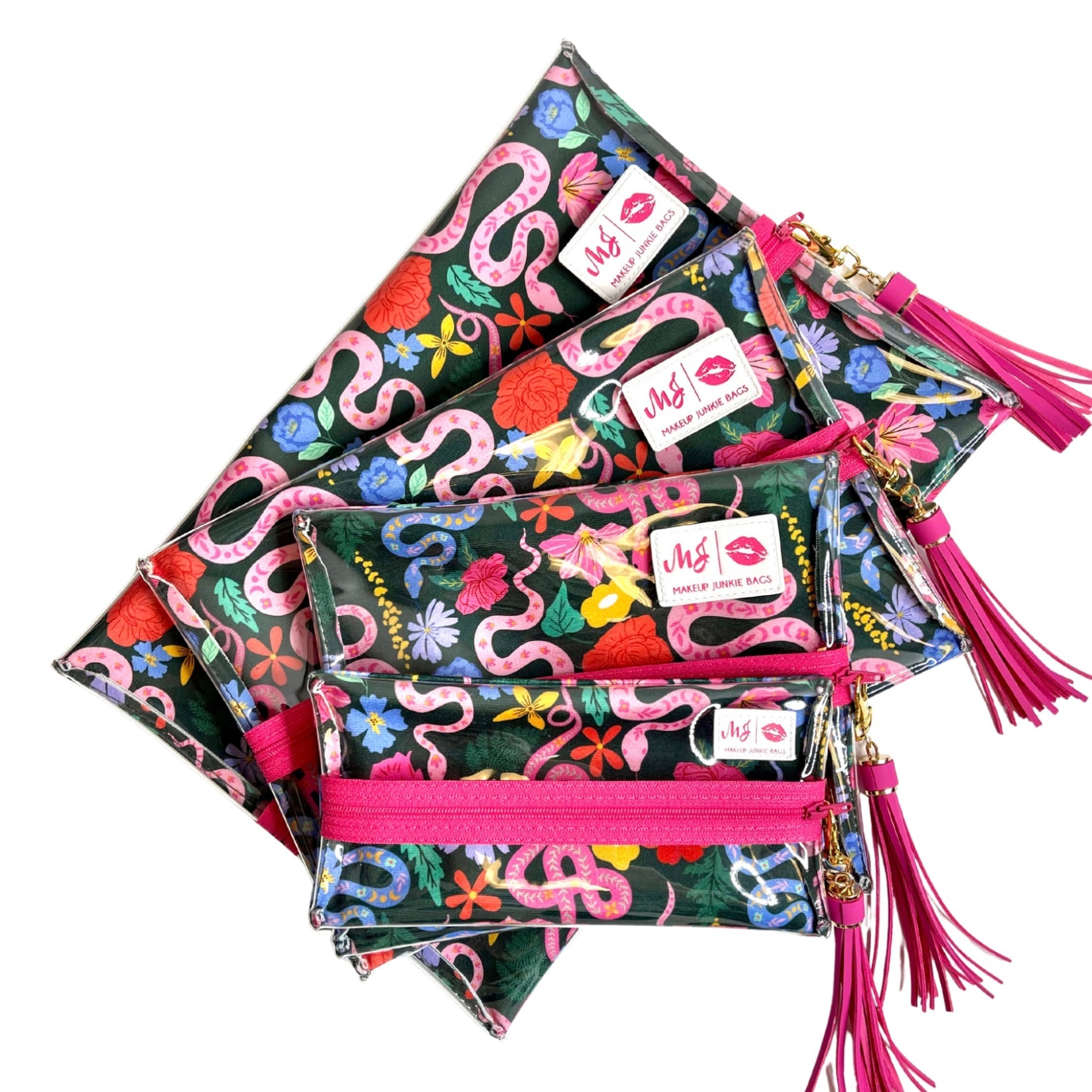 Colorful pouches with floral and snake patterns and pink zippers on a white background