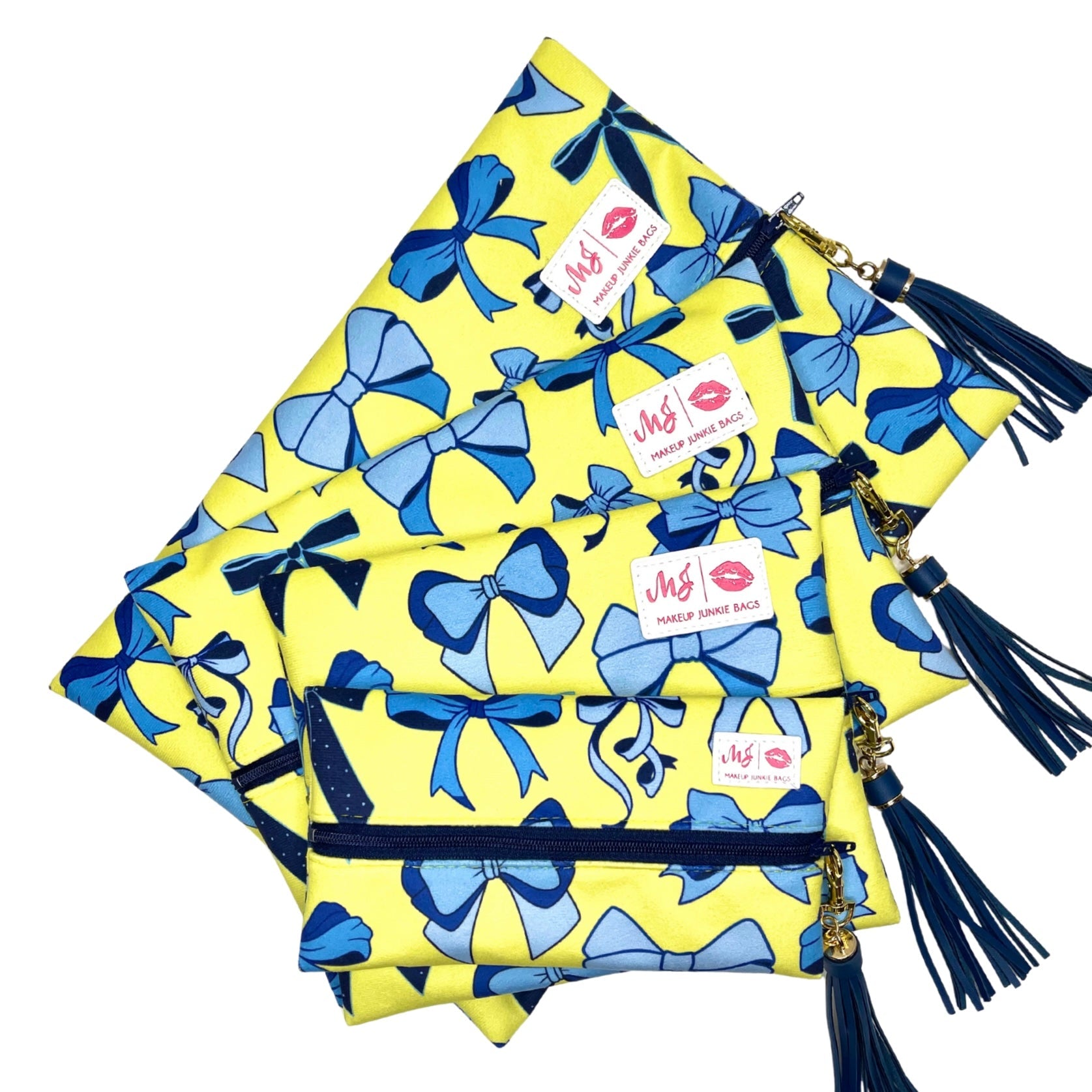 Set of yellow pouches with blue bows and tassels on a white background