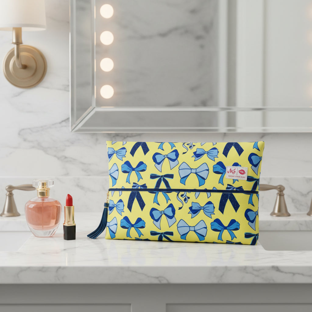 Yellow pouch with blue bow pattern on a white background