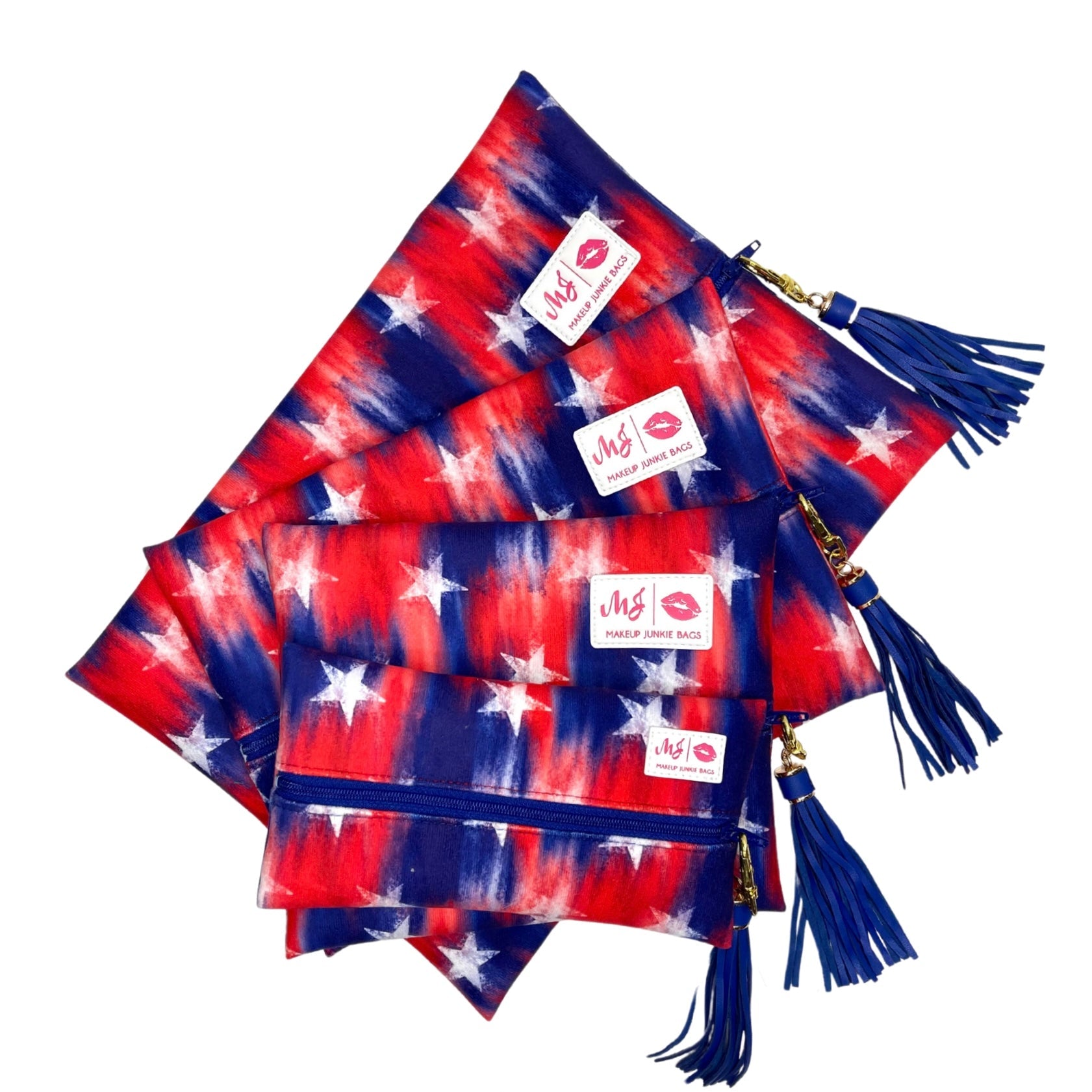 Red, white, and blue patterned bags with tassels on a white background