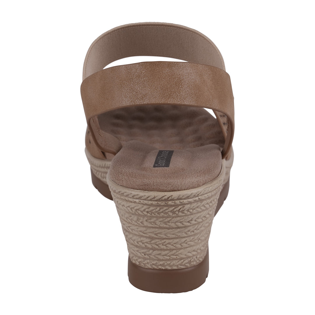 Brown wedge sandal with braided sole on a white background