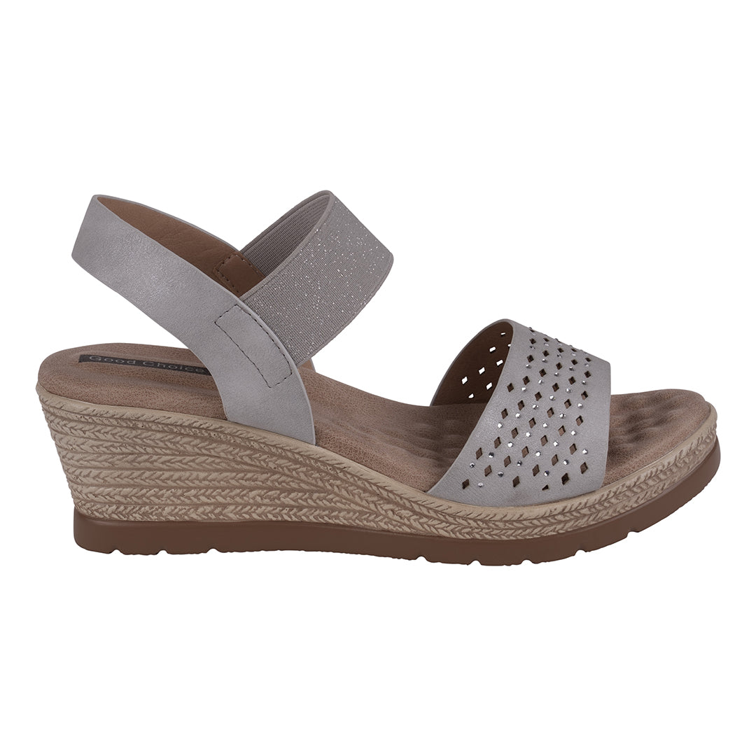 Gray wedge sandal with perforated design on a white background