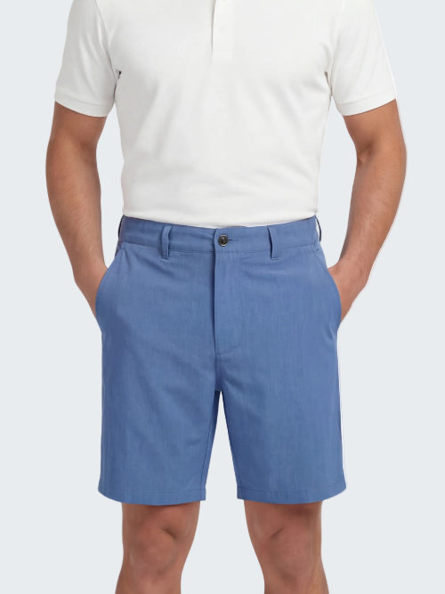 Person wearing blue shorts and a white polo shirt on a white background