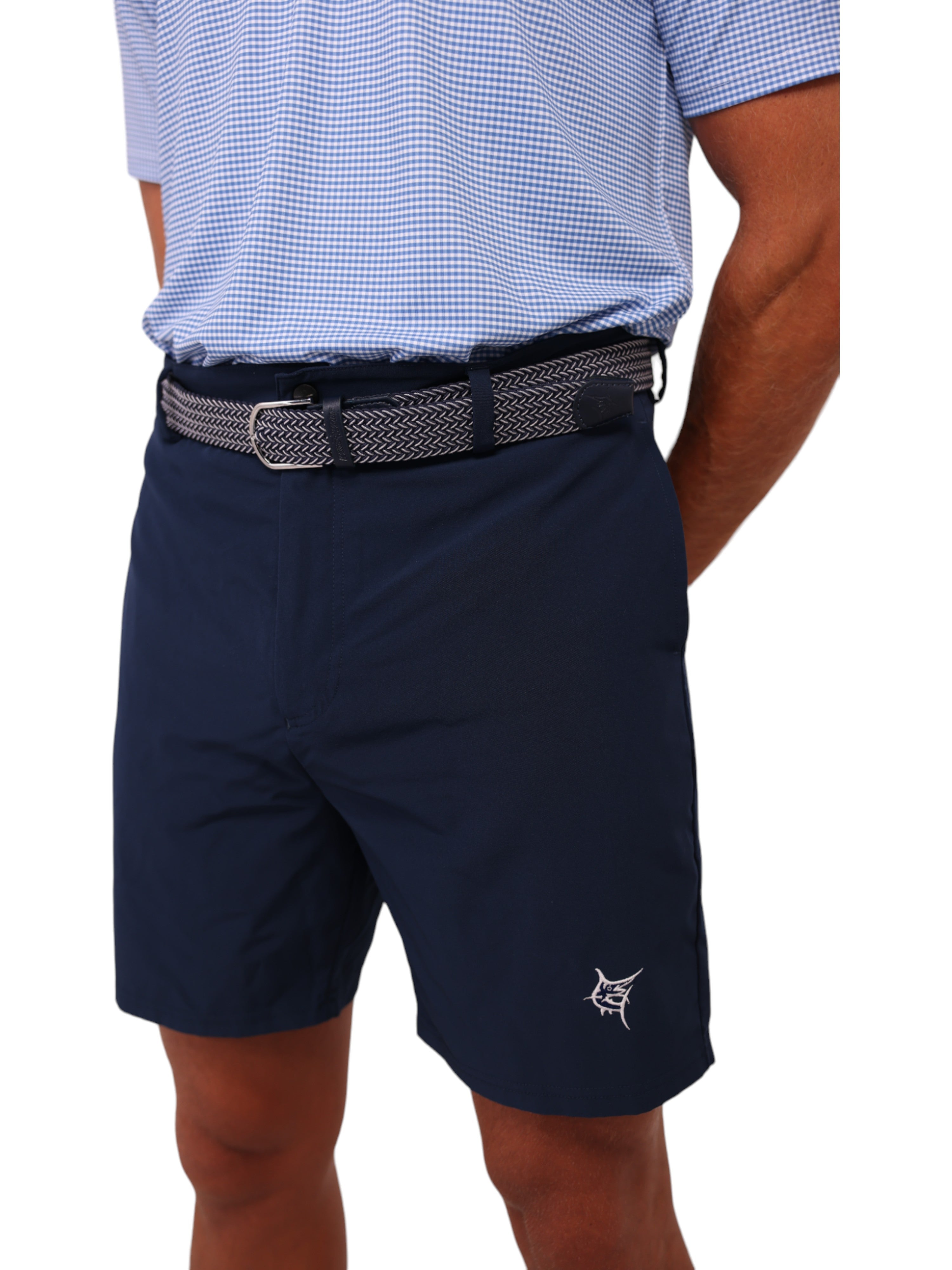 Person wearing navy shorts with a small logo on a white background
