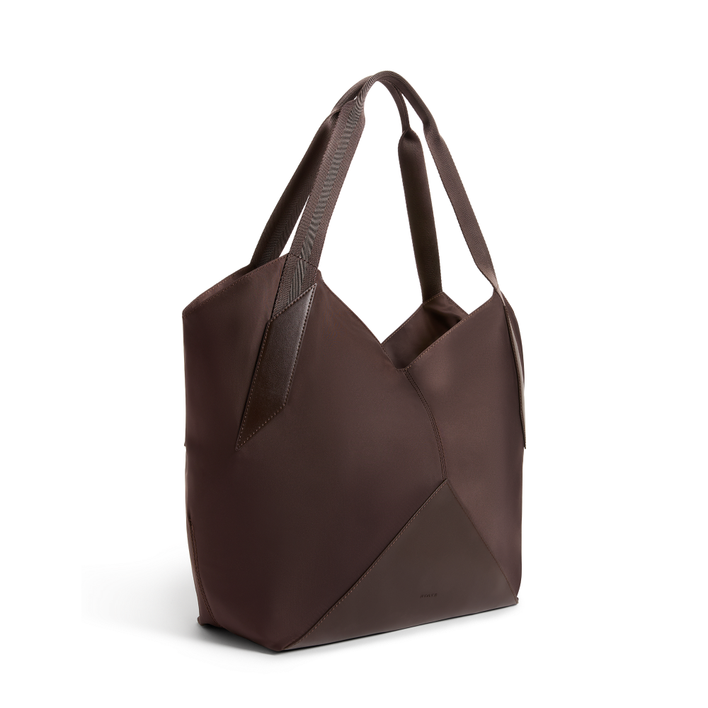 Brown leather handbag on a white background