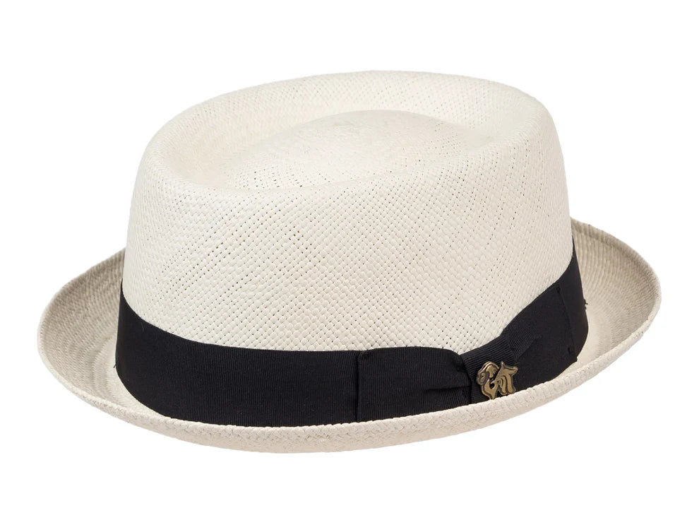 White straw hat with a black band and gold emblem on a white background