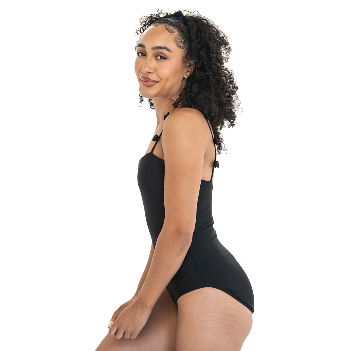 Woman wearing a black swimsuit on a white background