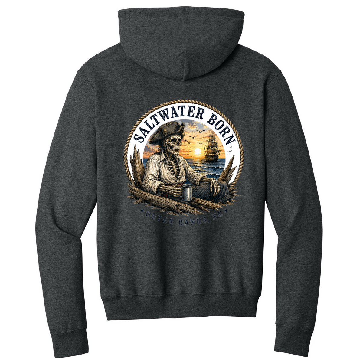 A dark heather gray hoodie shown from the back, featuring a large circular graphic print of a pirate skeleton sitting by the ocean at sunset with the text 'SALTWATER BORN' and 'Pirates Forever'.