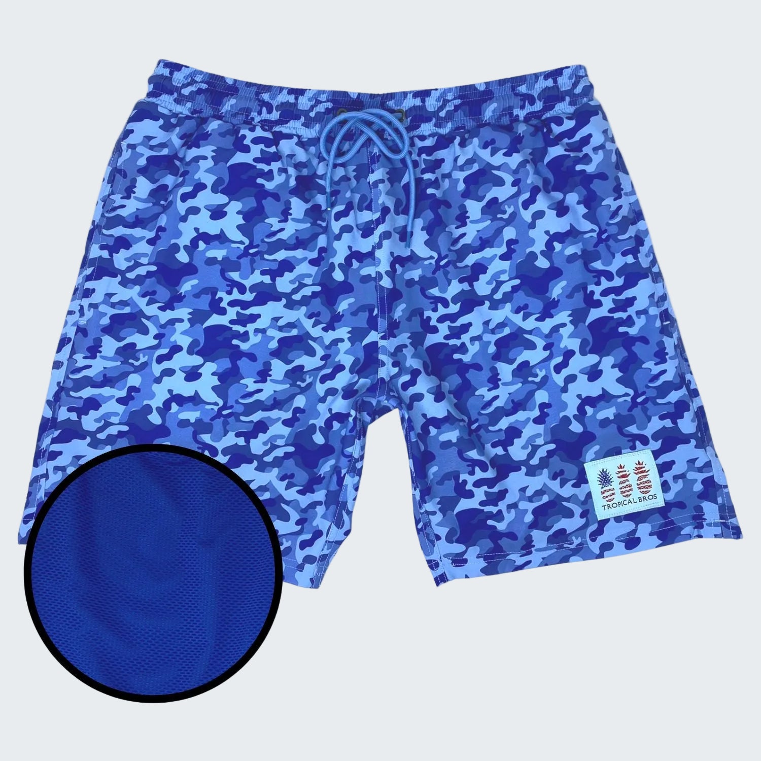 Blue camouflage swim shorts with a close-up of the fabric texture on a white background.