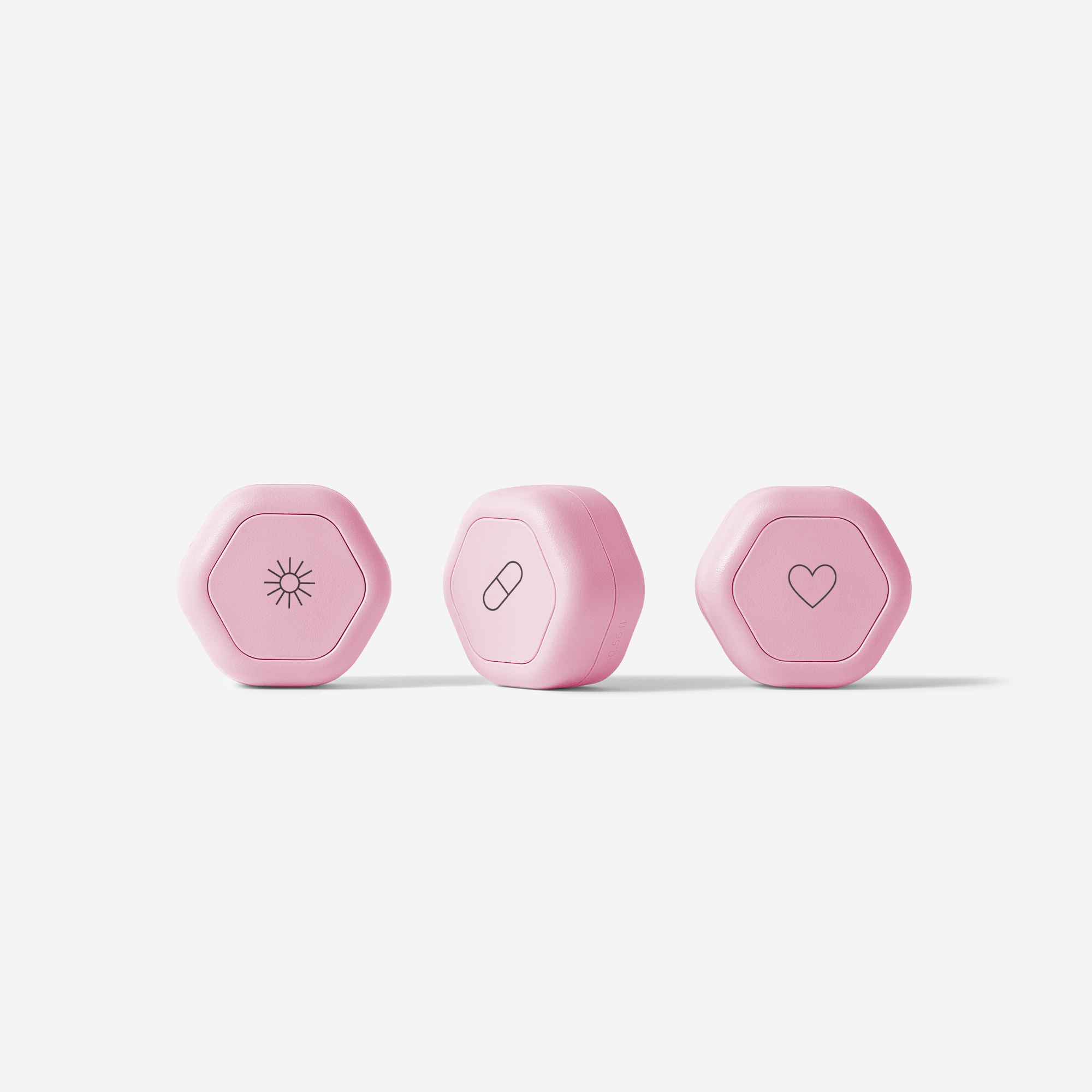 Three pink hexagonal devices with different symbols on a white background