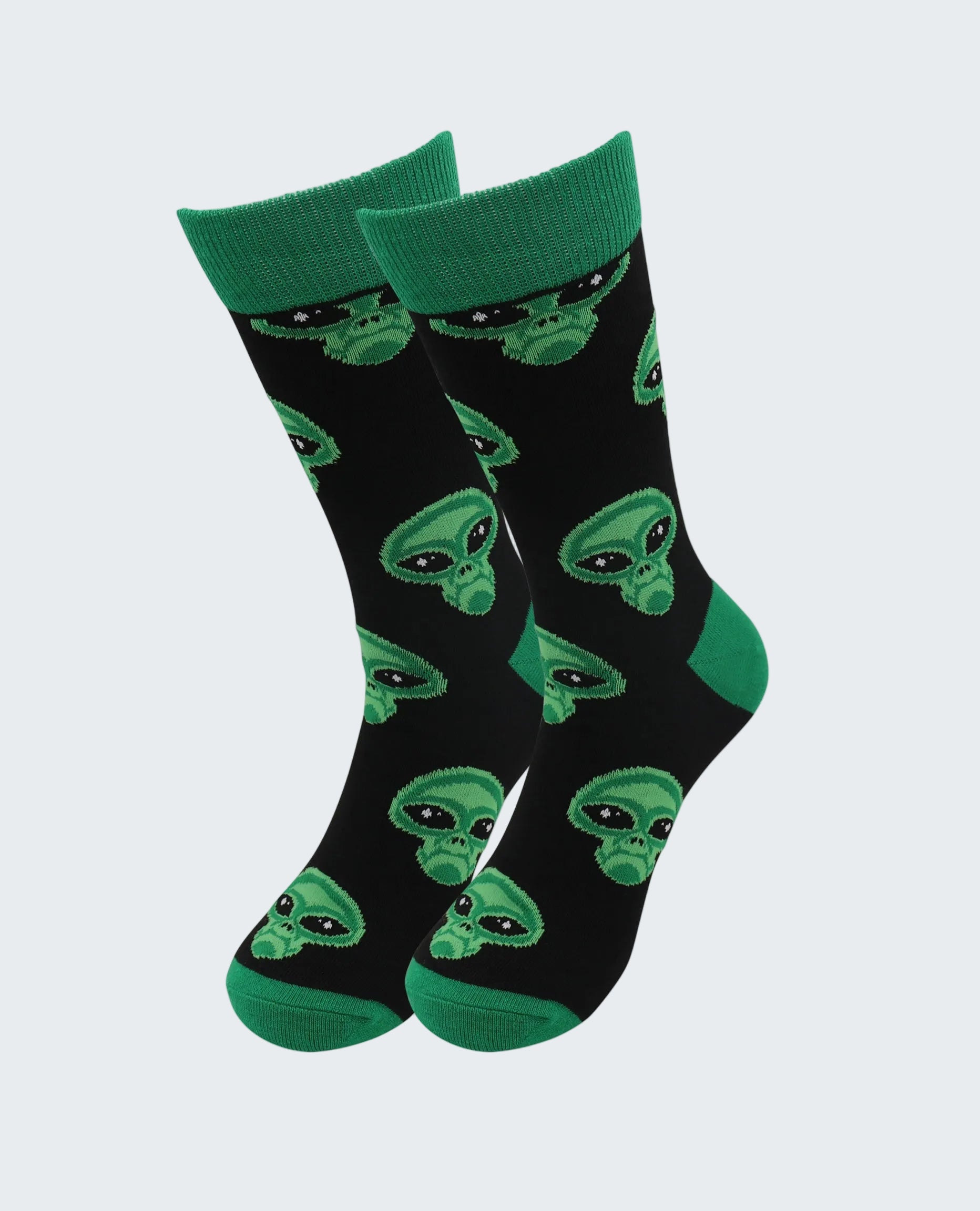 Black socks with green alien patterns on a white background