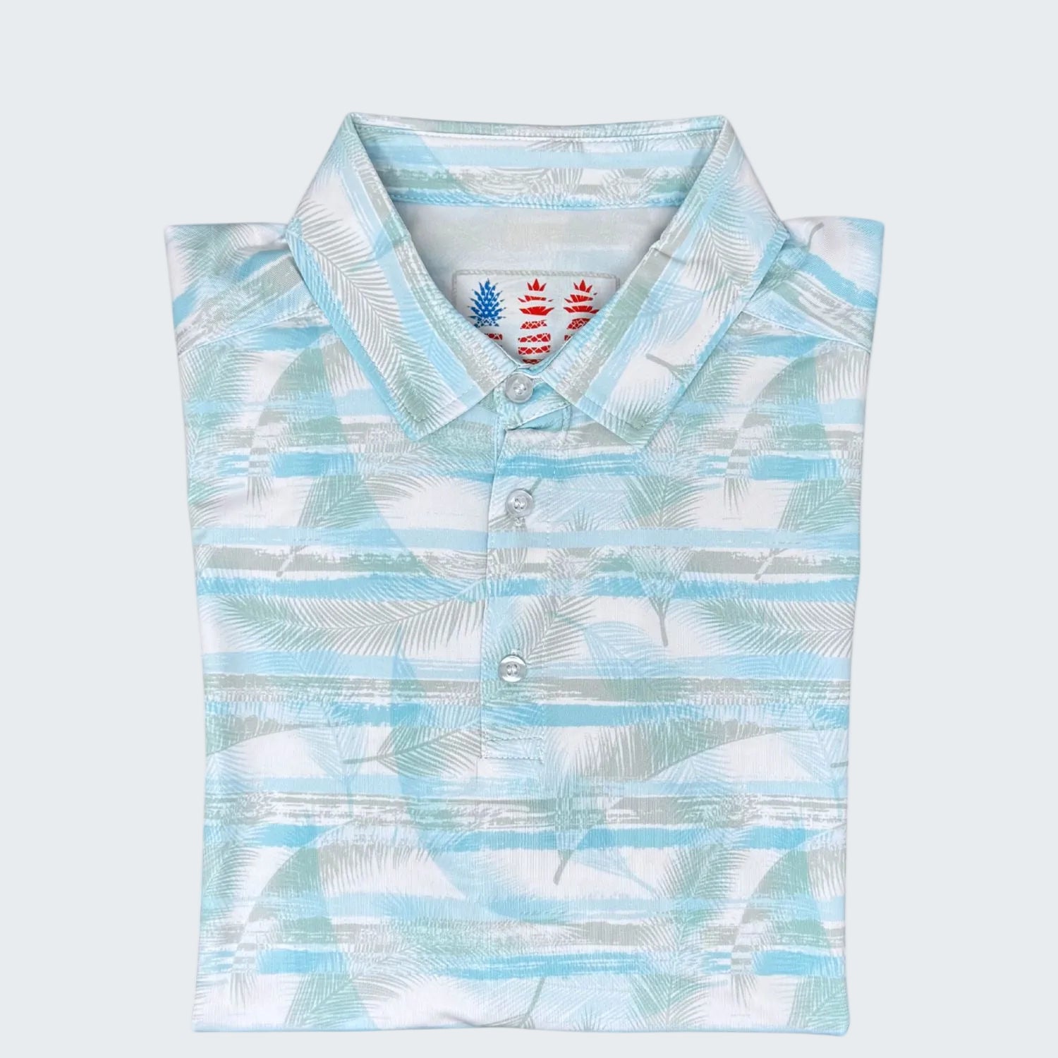 Limited edition polo shirt with palm leaf pattern on a white background