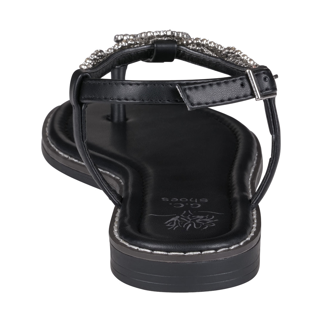 Black sandal with embellished strap on a white background