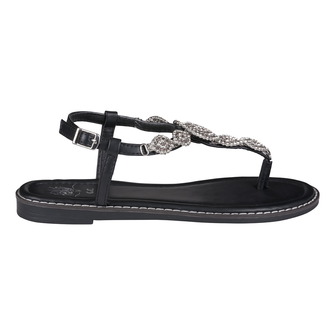 Black sandal with decorative straps on a white background