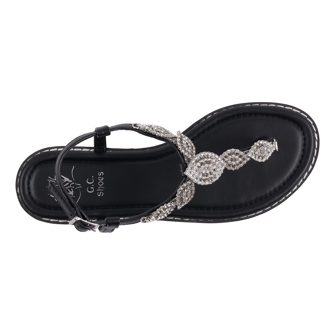 Black sandal with silver embellishments on a white background